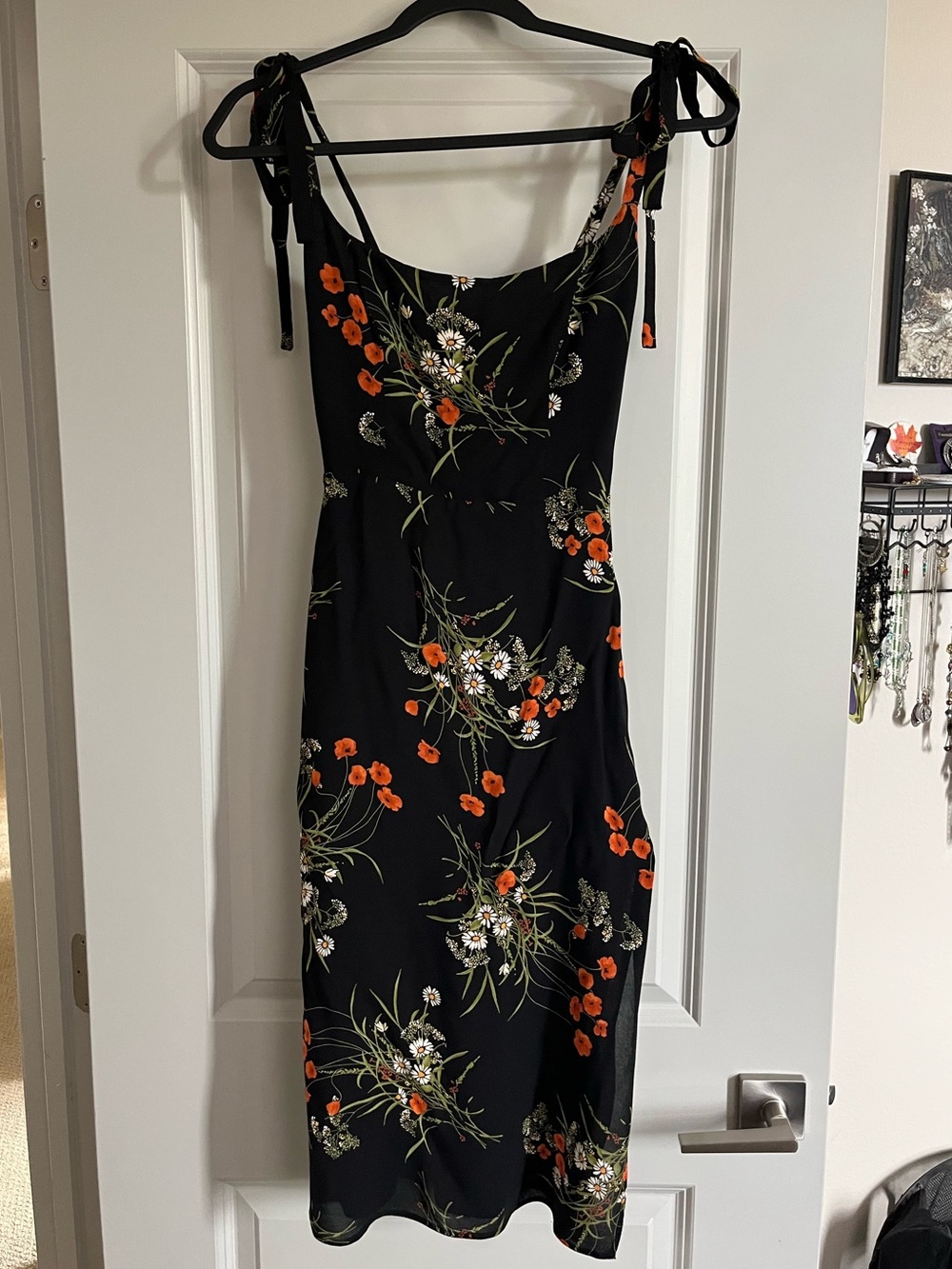 Black midi dress from Reformation with orange and white flowers